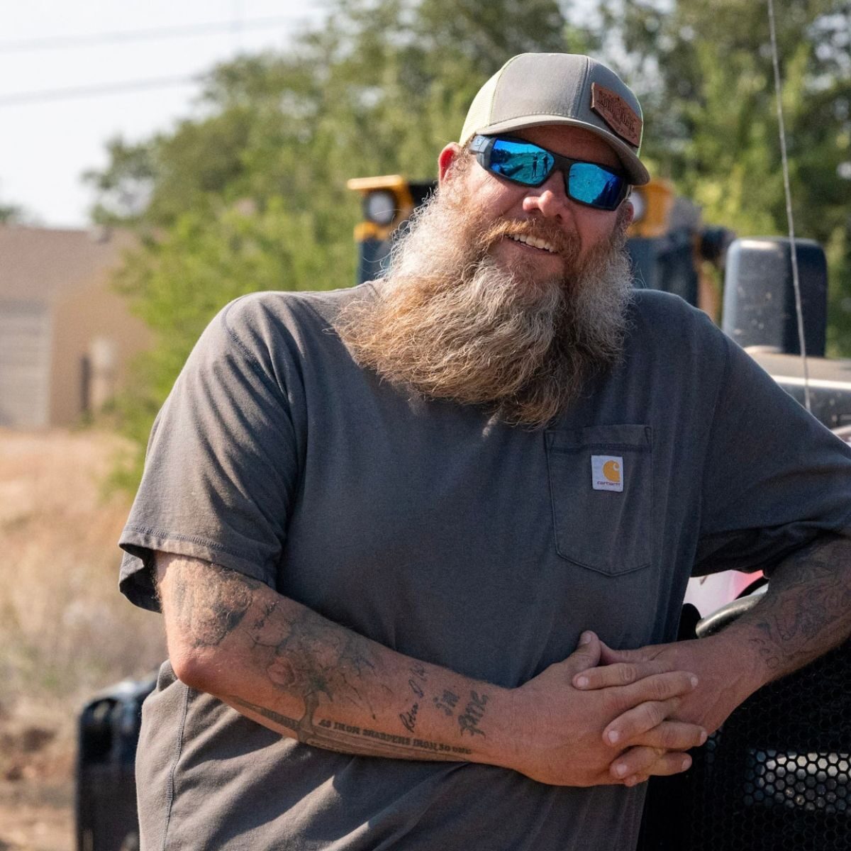 Doug Owsley wearing a cap and sunglasses.